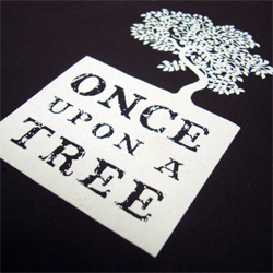 printed aprons for once upon tree printed cream on a brown apron